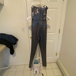 Sequined jumpsuit from mystique boutique. Size is small. Brand new with tags